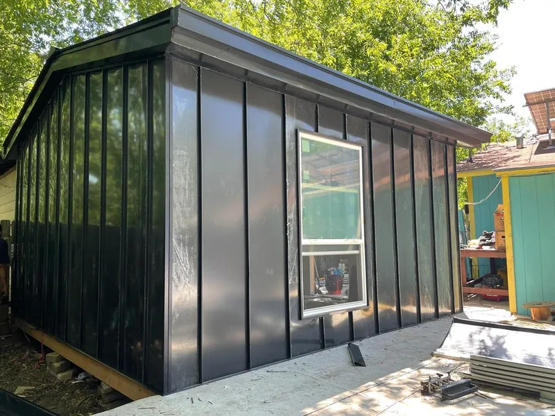 Black standing seam metal wall panels for Metal Roof Installation in Springville