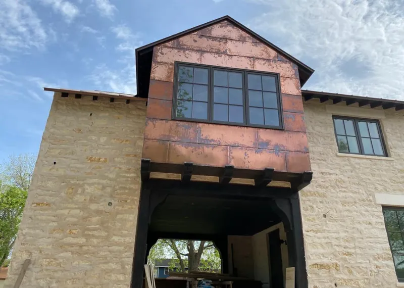 Copper metal panel facade on a stone building for Metal Roof Coating in Springville